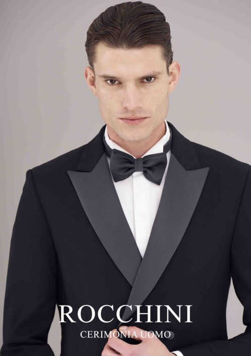 Uomo in vestito da matrimonio elegante nero con papillon, disponibile a Viterbo presso l'Atelier Ricci Sposo